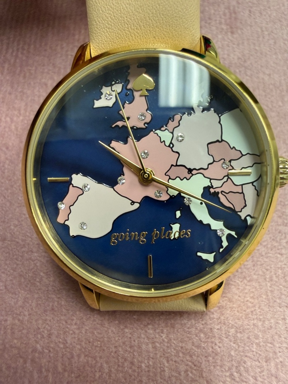 kate spade navy blue map dial watch with gold-tone case and cream strap